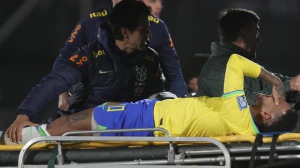 Brazil's Neymar is carried off the pitch on a stretcher.