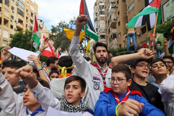 People take part in a demo<em></em>nstration organised by Lebanese Shiite group Hezbollah in the southern suburbs of Beirut on October 18, 2023, following a strike which ripped through a Gaza hospital compound killing hundreds the day before. Thousands rallied across the Arab world on October 18 to protest the deaths of hundreds of people in a strike on a Gaza hospital they blame on Israel, despite its denials. (Photo by ANWAR AMRO / AFP) (Photo by ANWAR AMRO/AFP via Getty Images)