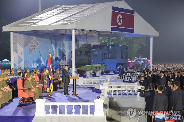 North Korean leader Kim Jong-un (C) delivers a speech during a ceremony to transfer a new tactical ballistic missile weapon system to front-line units taking place in Pyo<em></em>ngyang on Aug. 4, 2024, in this photo provided by the North's official Korean Central News Agency. (For Use o<em></em>nly in the Republic of Korea. No Redistribution) (Yonhap)