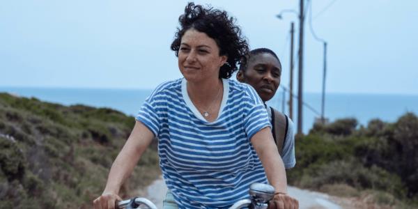 Alia Shawkat and Cynthia Erivo ride a bike in Drift