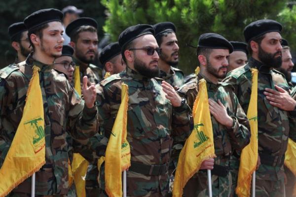 Fighters Hezbollah flags