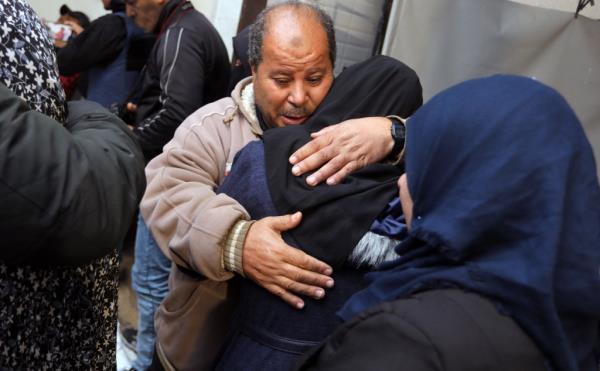 Palestinians mourn the loss of a person who was killed in Thursday's airstrike in Rafah. 