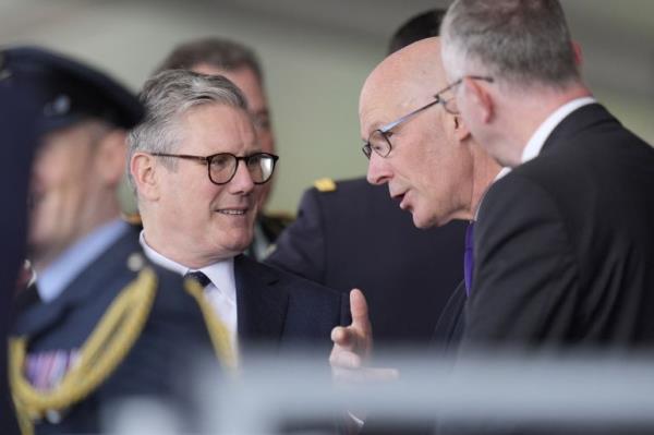 Labour Party leader Keir Starmer speaks with Scotland's First Minister John Swinney, as they attend the UK's natio<em></em>nal commemorative event for the 80th anniversary of D-Day, hosted by the Ministry of Defence on Southsea Common in Portsmouth, Britain June 5, 2024. Andrew Matthews/Pool via REUTERS