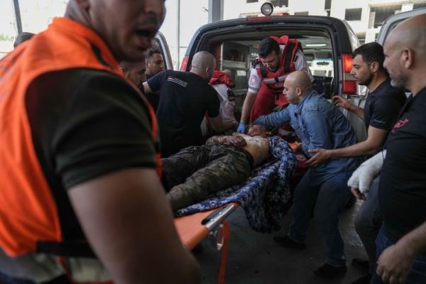 An injured Palestinian is carried into a hospital during an Israeli military raid in the Jenin refugee camp, a militant stro<em></em>nghold in the occupied West Bank, Monday, July 3, 2023. (AP Photo/Nasser Nasser)