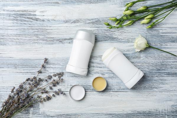 deodorant on table with roses